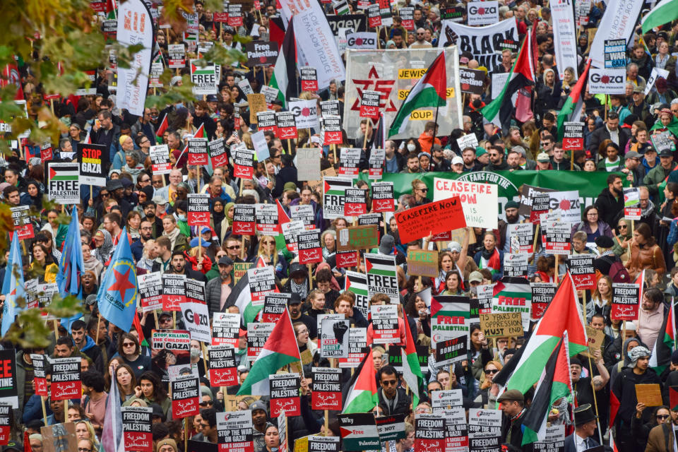 LONDON, UNITED KINGDOM - 2023/10/28: Protesters march with Palestinian flags and pro-Palestine placards during the demonstration on Victoria Embankment. Tens of thousands of people marched in central London in solidarity with Palestine as the Israel-Hamas war intensifies. (Photo by Vuk Valcic/SOPA Images/LightRocket via Getty Images)