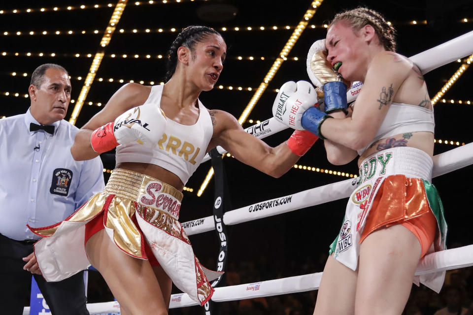 Amanda Serrano, left, punches Heather Hardy during the first round of a boxing match Friday, Sept. 13, 2019, in New York. Serrano won the fight. (AP Photo/Frank Franklin II)