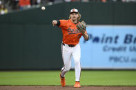 Baltimore Orioles shortstop Gunnar Henderson throws to first base to put out Oakland Athletics' Abraham Toro during the second inning of a baseball game, Saturday, April 27, 2024, in Baltimore. (AP Photo/Nick Wass)