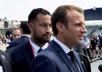 FILE PHOTO: French President Emmanuel Macron walks ahead of his aide Alexandre Benalla at the end of the Bastille Day military parade in Paris, France, July 14, 2018.  REUTERS/Philippe Wojazer/File Photo