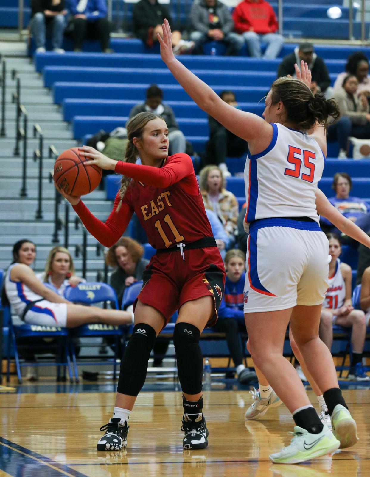 Bullitt East's Anna Rodgers (11) looks to pass against Southwestern's Payton Acey (55) during the Girls LIT at the Valley High School gym in Louisville, Ky. on Jan. 25, 2023.