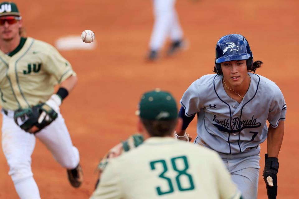 The University of North Florida's Matthew Clement is caught in rundown during a 2023 game against Jacksonville University at Sessions Stadium.