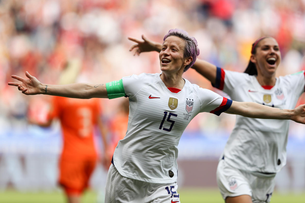 LYON, FRANCE - JULY 07: Megan Rapinoe of the USA celebrates scoring the first goal from the penalty spot with Alex Morgan during the 2019 FIFA Women's World Cup France Final match between The United State of America and The Netherlands at Stade de Lyon on July 07, 2019 in Lyon, France. (Photo by Richard Heathcote/Getty Images)