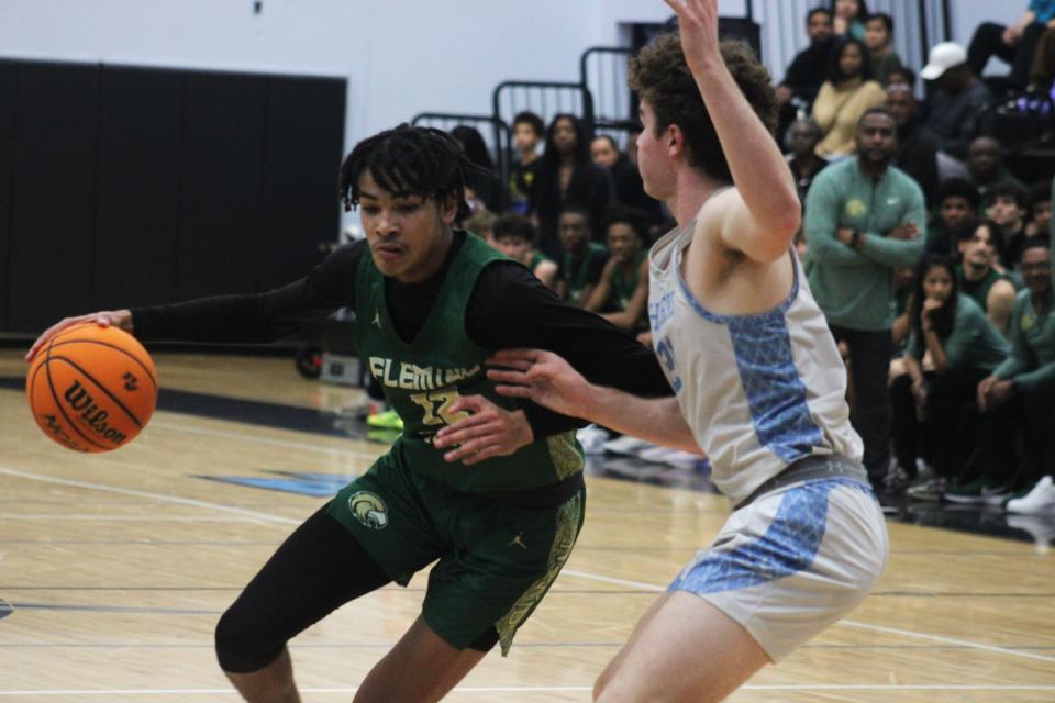 Fleming Island forward Carson Crawford (12) dribbles into the lane against Ponte Vedra.