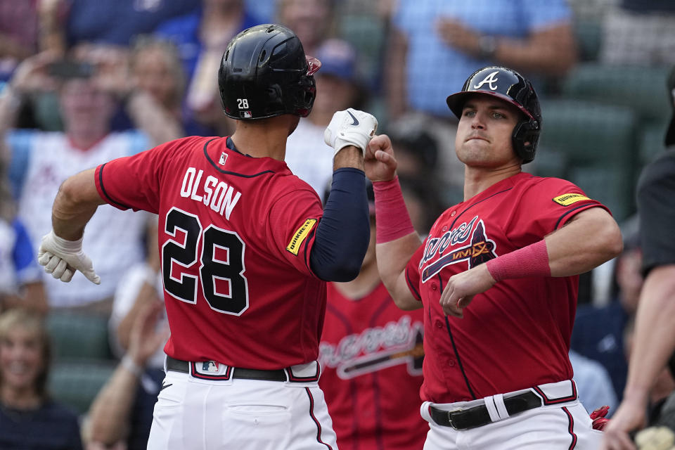Atlanta Braves' Matt Olson (28) celebrates with Austin Riley after hitting a two-run home against the Miami Marlins during the first inning of a baseball game Friday, June 30, 2023, in Atlanta. (AP Photo/John Bazemore)