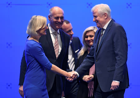 Horst Seehofer, outgoing leader of the Christian Social Union (CSU) shakes hands with Deputy Chairwoman Angelika Niebler, during the party meeting in Munich, Germany, January 19, 2019. REUTERS/Andreas Gebert