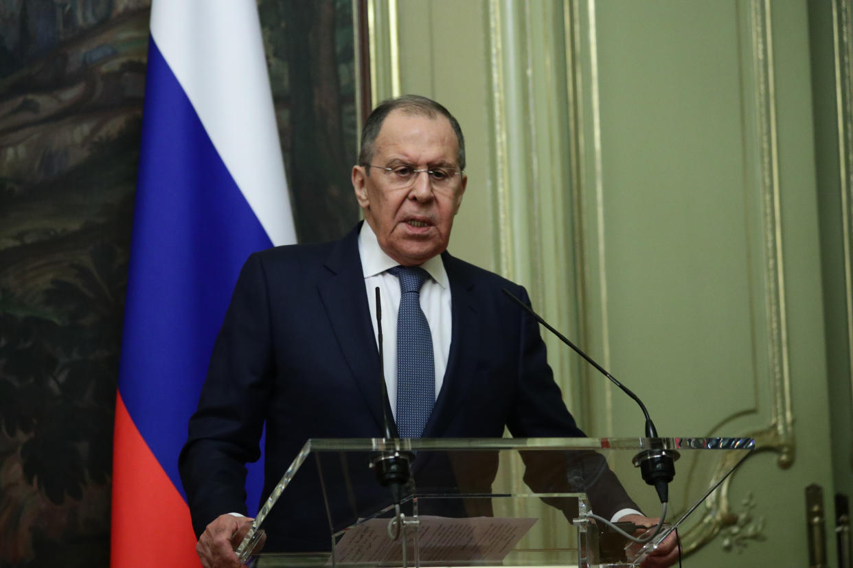 Russian Foreign Minister Sergey Lavrov stands at a podium during a press conference.