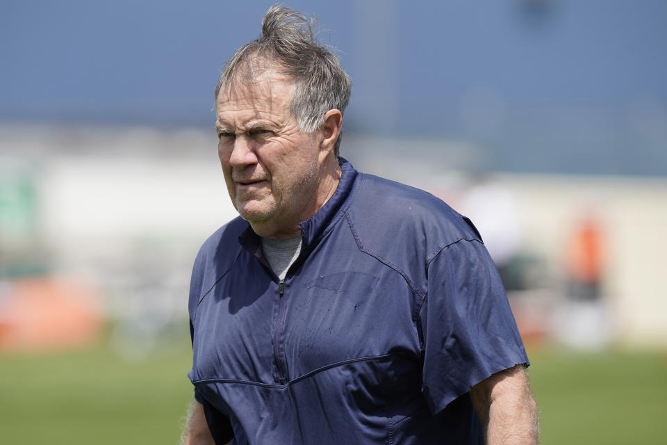 New England Patriots head coach Bill Belichick approaches a news conference to face reporters before an NFL football team practice, Tuesday, June 7, 2022, in Foxborough, Mass. (AP Photo/Steven Senne)