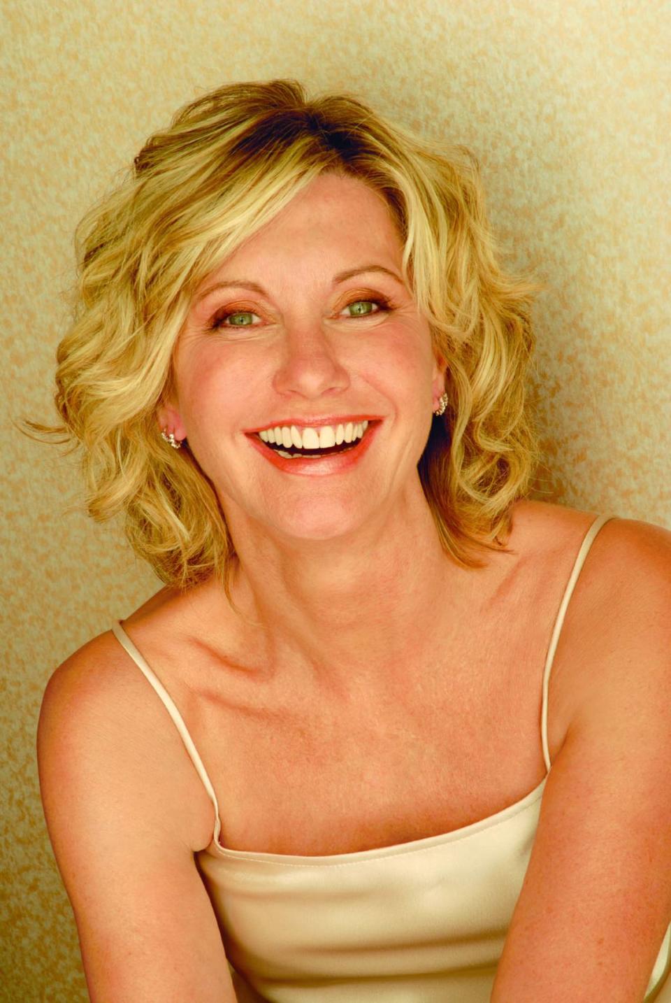 11/02/06--hand out--Pop singer Olivia Newton-John, in 2006, is spreading her message about breast cancer awareness and is on tour to promote her CD, Grace and Gratitude. She performs Dec. 2 at Carnival Center.