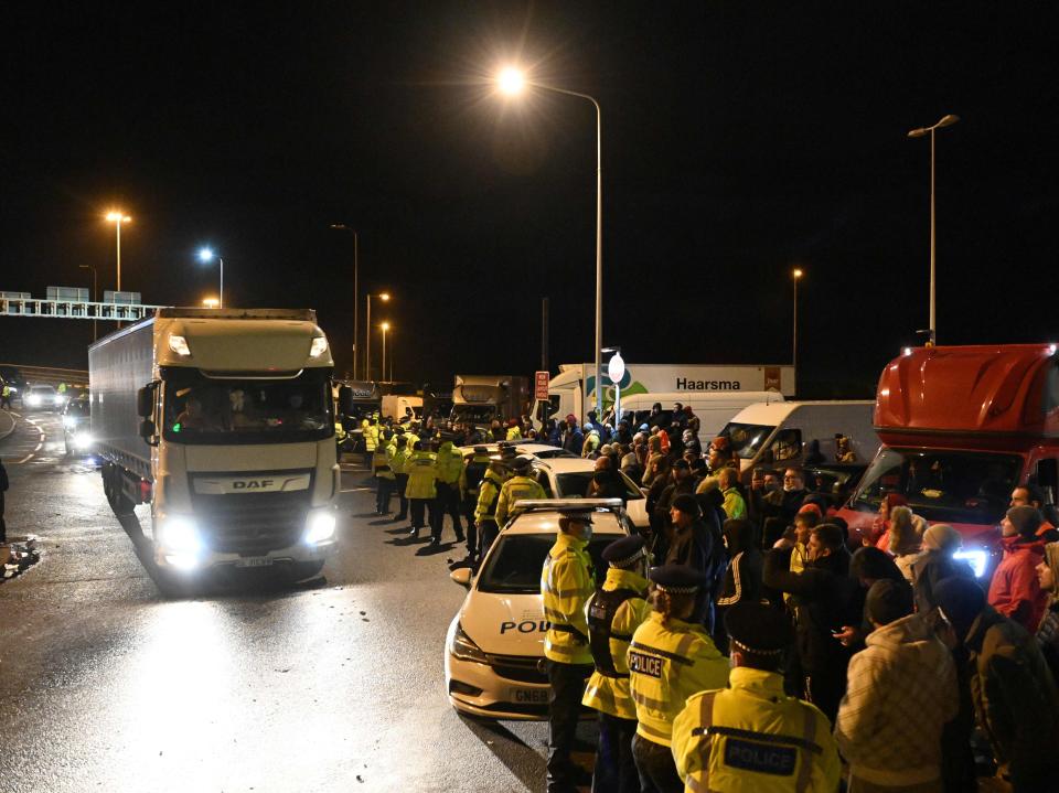 Police officers and lorry drivers congregate at the entrance to the Port of DoverJustin Tallis/AFP via Getty Images
