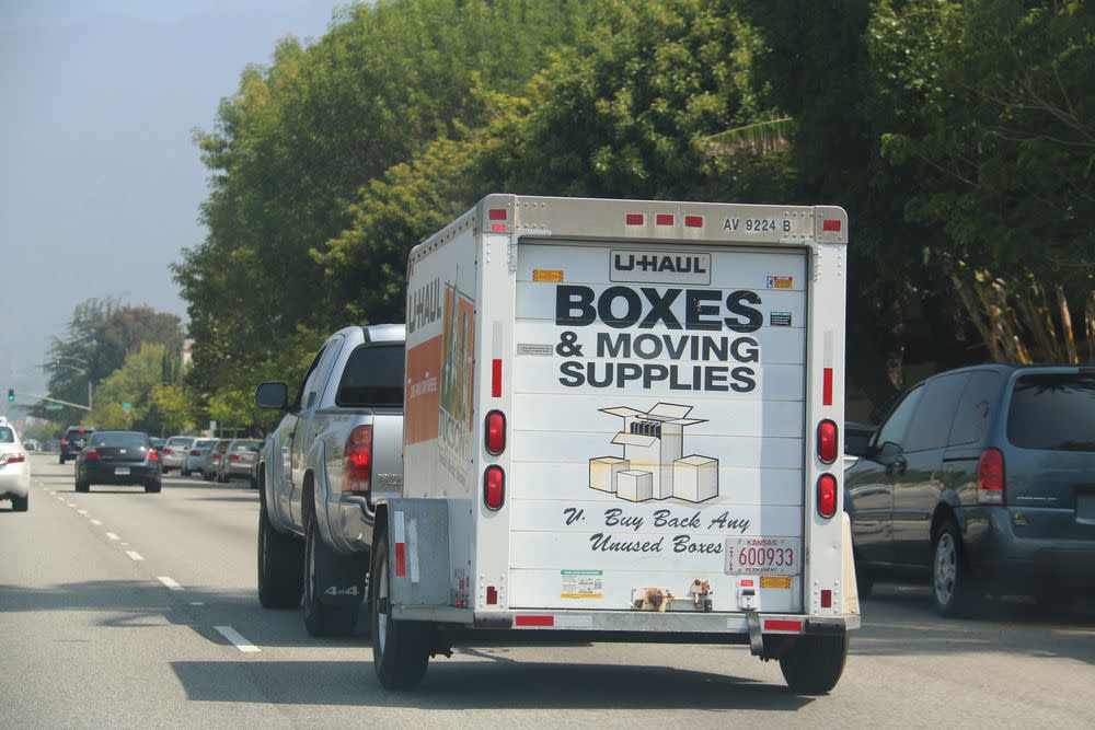 A U Haul truck rides along on a roadway in Los Angeles CA.