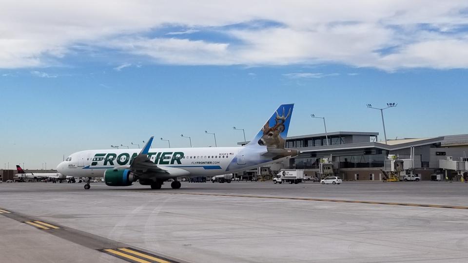 A Frontier Airlines plane at Phoenix Sky Harbor International Airport's Terminal 3.