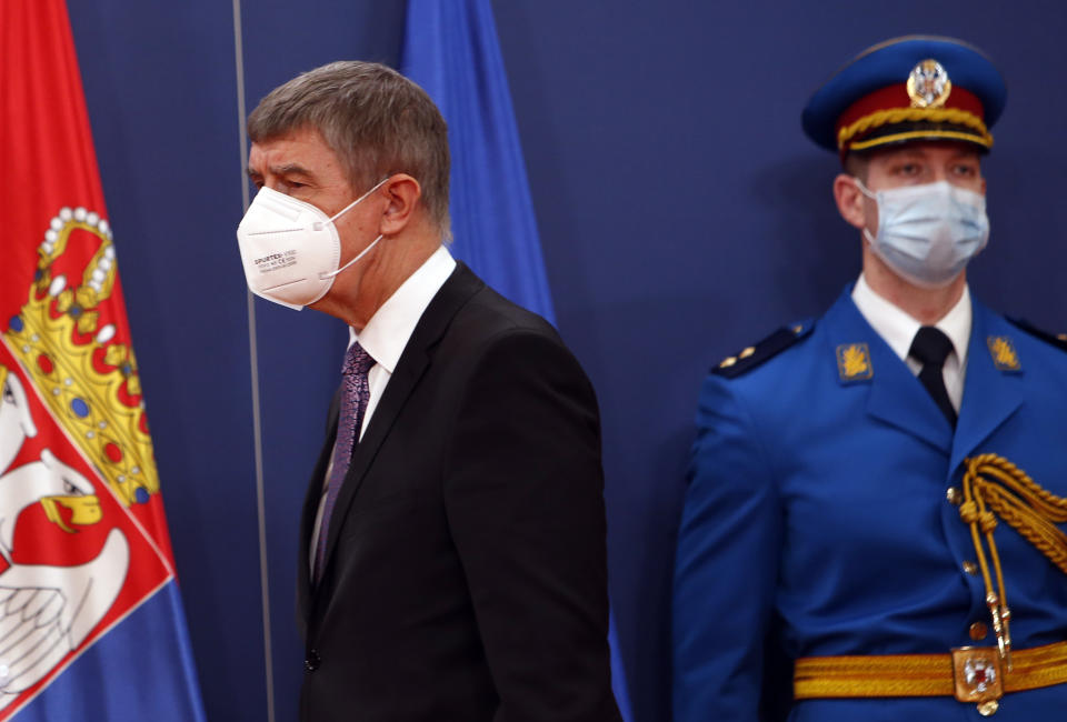 Czech Prime Minister Andrej Babis, left, arrives at a press conference after talks with his Serbian counterpart Ana Brnabic at the Serbia Palace in Belgrade, Serbia, Wednesday, Feb. 10, 2021. Babis is on a one-day official visit to Serbia. (AP Photo/Darko Vojinovic)