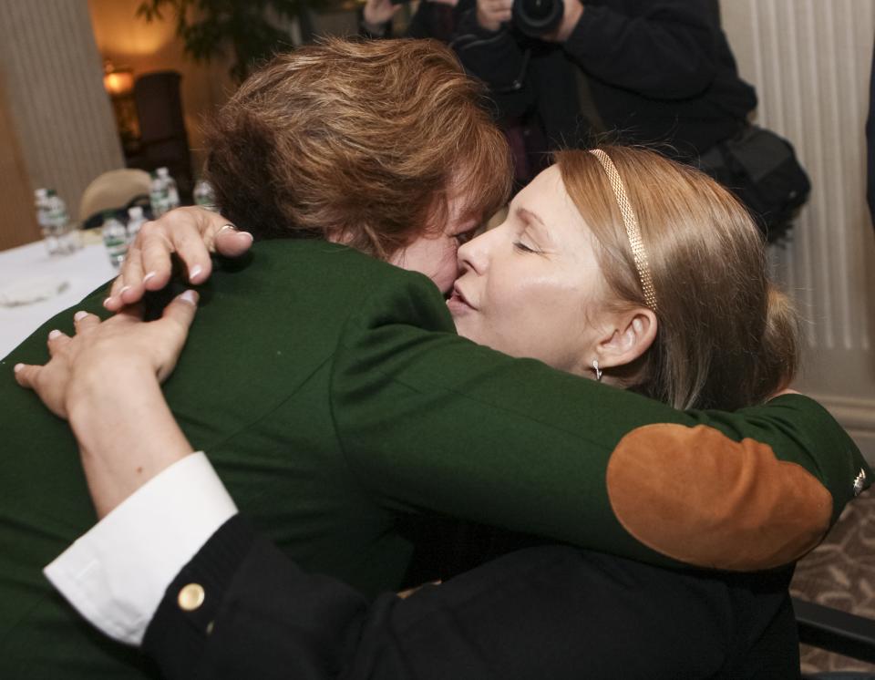 EU Foreign Policy Chief Catherine Ashton, left, and former Ukrainian Prime Minister Yulia Tymoshenko embrace as they meet in Kiev, Ukraine, Tuesday, Feb. 25, 2014. The European Union’s top foreign policy official urged Ukraine’s new government to work out a reform program so that the West could consider financial aid to the country’s battered economy. (AP Photo/Olexander Prokopenko, Pool)