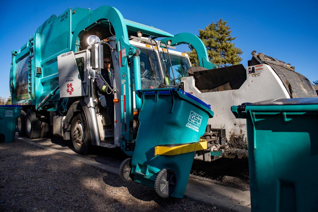 A Gallegos Sanitation truck picks up trash cans on West Olive Street in Fort Collins, Colorado on March 23, 2022.
Gallegos, family owned for 61 years, sold to Arizona-bases waste collector Republic Services in 2021.