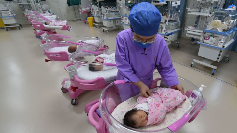 A nurse cares for a newborn at the Women and Children's Hospital in Fuyang City, Anhui province, on August 8, 2022. - CFOTO/Future Publishing/Getty Images