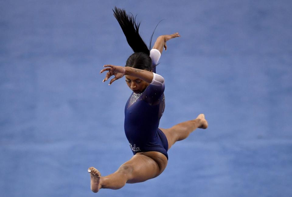 UCLA gymnast Nia Dennis competes in the balance beam against Arizona State Wildcats on Saturday. (MediaNews Group/Pasadena Star-News via Getty Images via Getty Images)