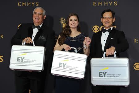 69th Primetime Emmy Awards – Arrivals – Los Angeles, California, U.S., 17/09/2017 - Ernst & Young representatives display briefcases containing show results. REUTERS/Mike Blake