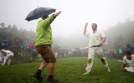 A man reacts after winning a fight during "Hundstoa Ranggeln" at Hundstein mountain near the village of Maria Alm