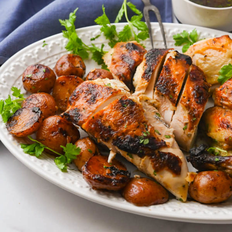 <p>Garlic & Zest</p><p>This awesome mojo-marinated spatchcock chicken is roasted with potatoes and onions for a complete meal everyone will love.</p><p><strong>Get the recipe: <a href="https://www.garlicandzest.com/sour-orange-garlic-mojo-butterflied-roast-chicken/" rel="nofollow noopener" target="_blank" data-ylk="slk:Sour Orange Garlic Mojo Butterflied Roast Chicken;elm:context_link;itc:0;sec:content-canvas" class="link ">Sour Orange Garlic Mojo Butterflied Roast Chicken</a></strong></p>