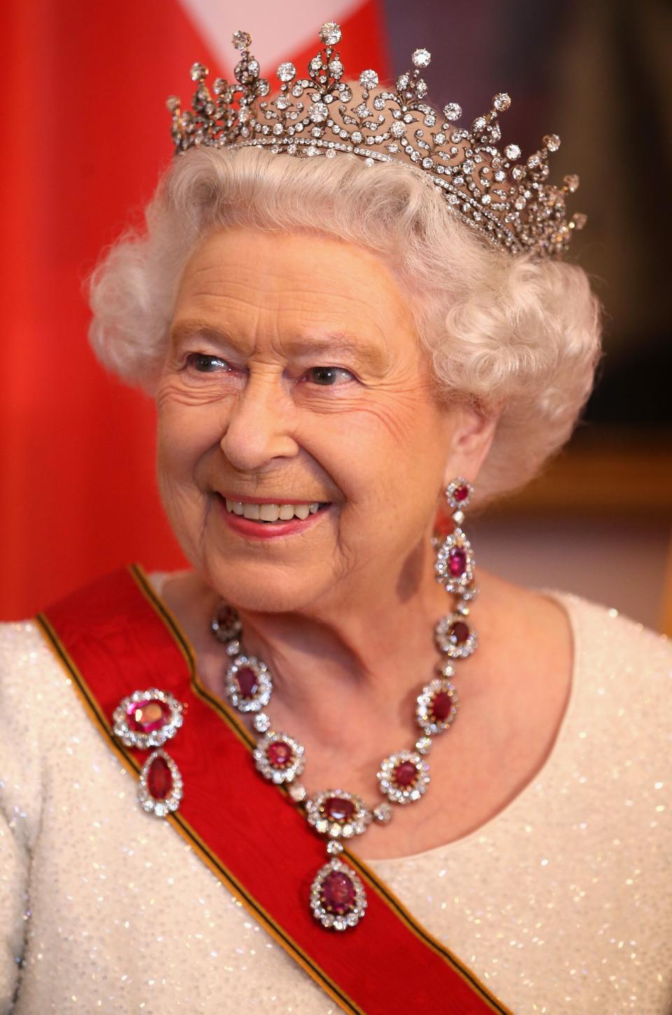 <p>Tiara or no tiara, the Queen’s perfectly coiffed hair is instantly recognisable. She’s worn it the same way for almost all of her life (set in rollers and relatively short) and we wouldn’t have it any other way. <em>[Photo: PA]</em> </p>