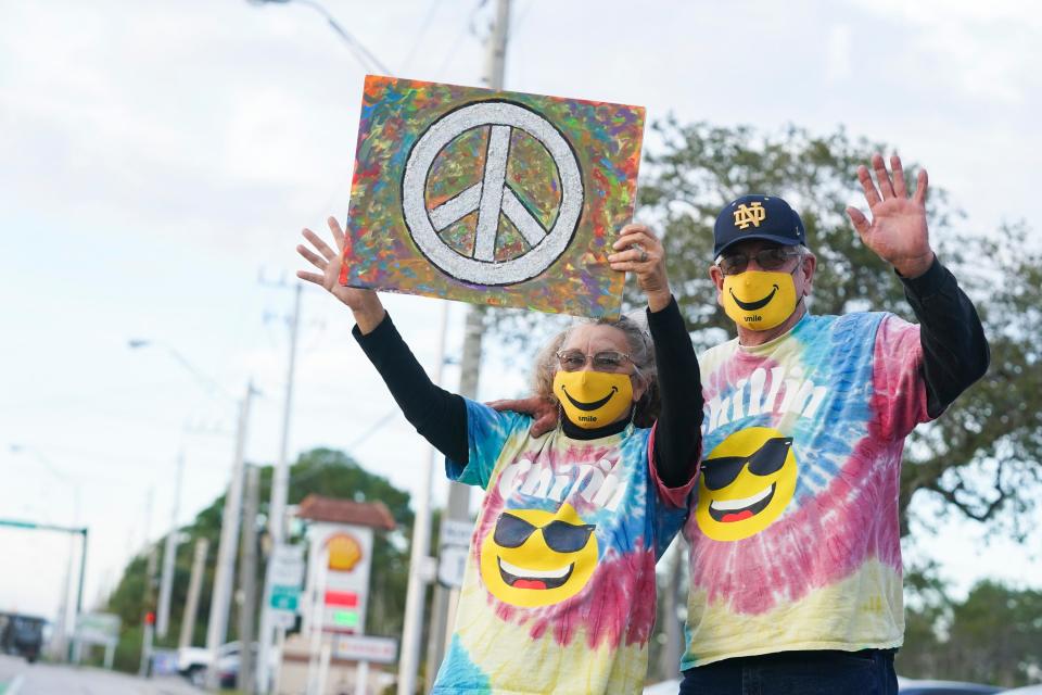 About 70 people gather at the northeast end of the Roosevelt Bridge on the first anniversary of the U.S. Capitol insurrection to rally for voting rights Thursday, Jan. 6, 2022, in Stuart. 