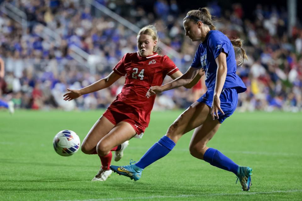 BYU’s Kendell Petersen (16) moves the ball past Utah’s Bella Woods (24) during the game at Ute Field in Salt Lake City on Saturday, Sept. 9, 2023. | Spenser Heaps, Deseret News