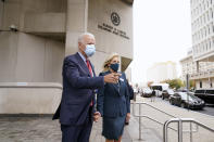 Democratic presidential candidate former Vice President Joe Biden and his wife Jill Biden pause to speak to the media after they voted at the Carvel State Office Building, Wednesday, Oct. 28, 2020, in Wilmington, Del. (AP Photo/Andrew Harnik)