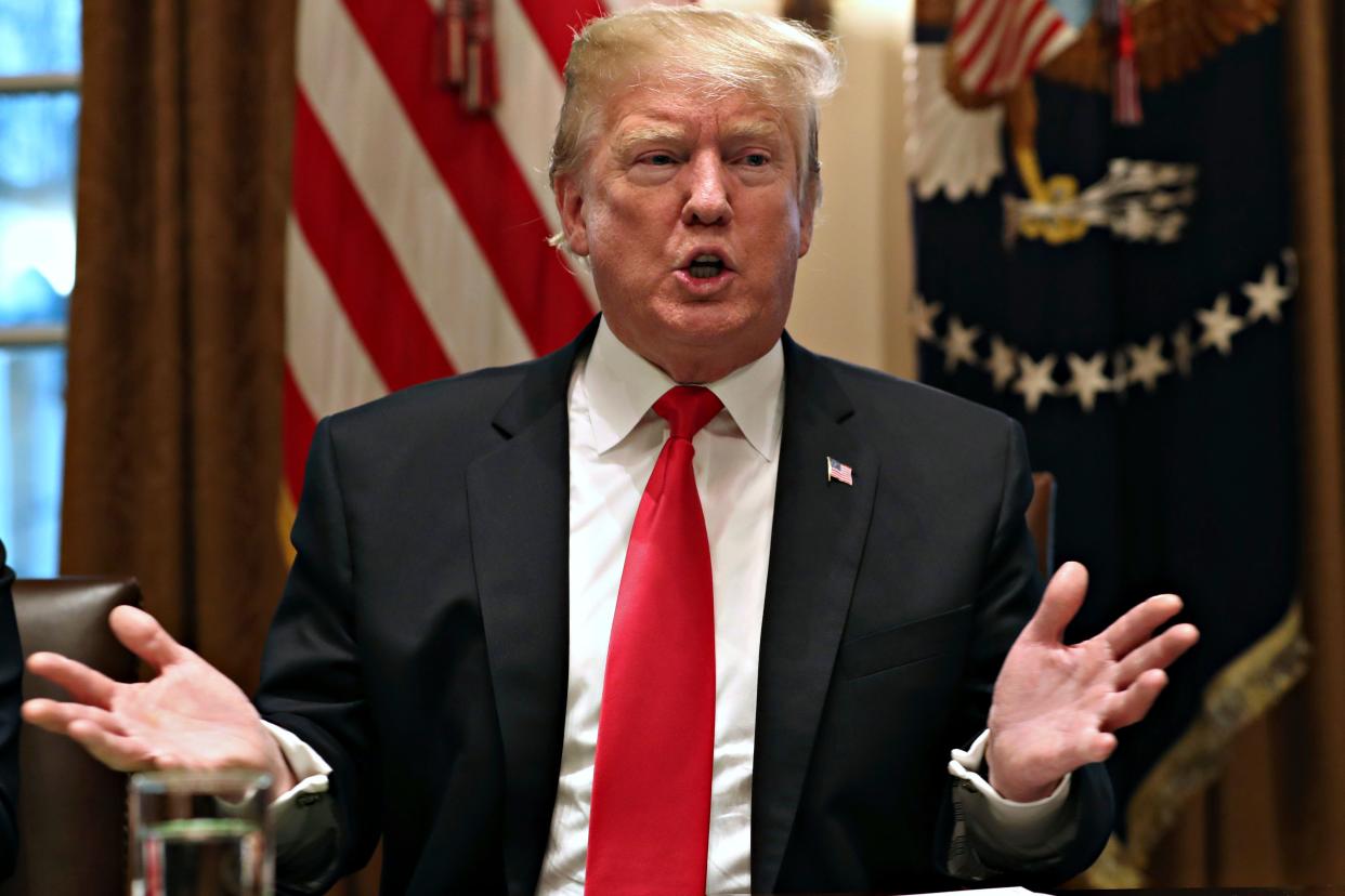 President Donald Trump is pictured speaking to reporters at the White House.