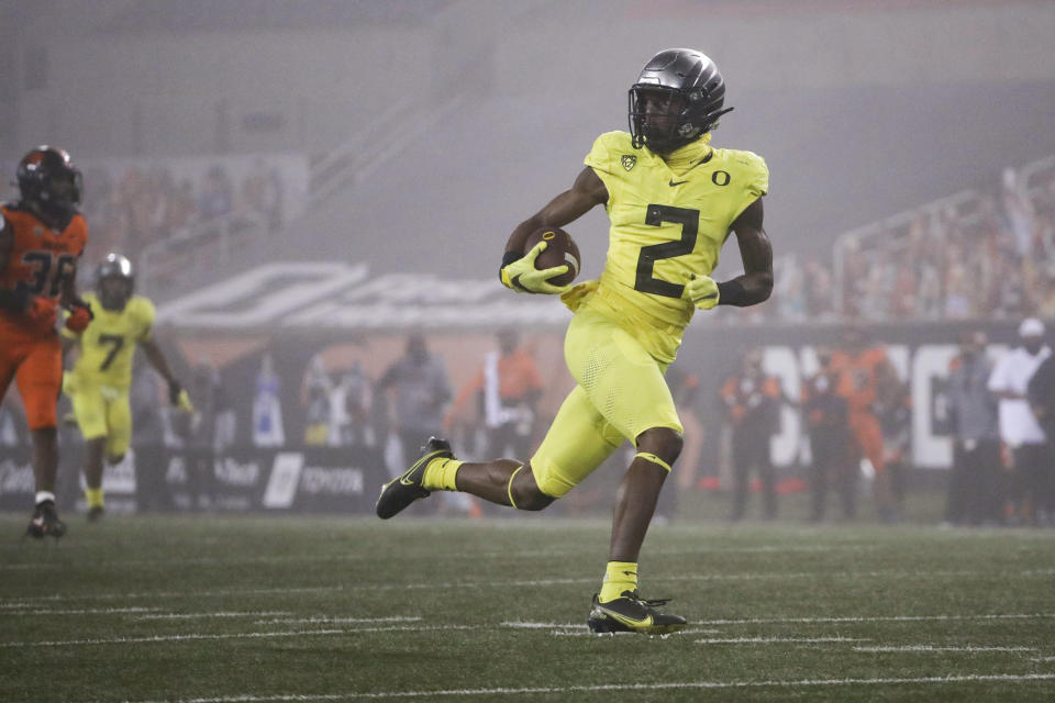 Oregon wide receiver Devon Williams (2) runs to the end zone for a touchdown reception during the first half of the team's NCAA college football game against Oregon State in Corvallis, Ore., Friday, Nov. 27, 2020. (AP Photo/Amanda Loman)