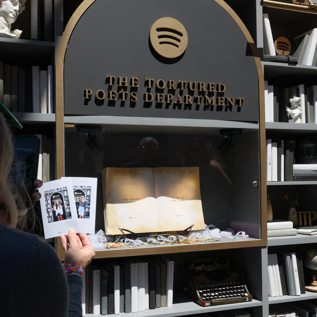  Attendees take pictures at Spotify's Taylor Swift pop-up at The Grove for her new album "The Tortured Poets Department" at The Grove on April 16, 2024 in Los Angeles, California. . 
