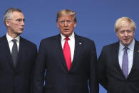 NATO Secretary General Jens Stoltenberg, left, and British Prime Minister Boris Johnson, right, welcome U.S. President Donald Trump during a NATO leaders meeting at The Grove hotel and resort in Watford, Hertfordshire, England, Wednesday, Dec. 4, 2019. NATO Secretary-General Jens Stoltenberg rejected Wednesday French criticism that the military alliance is suffering from brain death, and insisted that the organization is adapting to modern challenges. (AP Photo/Francisco Seco)