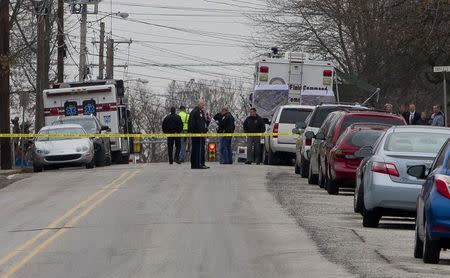 Police has the streets taped off as the search near a home in a suburb of Philadelphia where a suspect in five killings was believed to be barricaded in Souderton, Pennsylvania, December 15, 2014. REUTERS/Brad Larrison