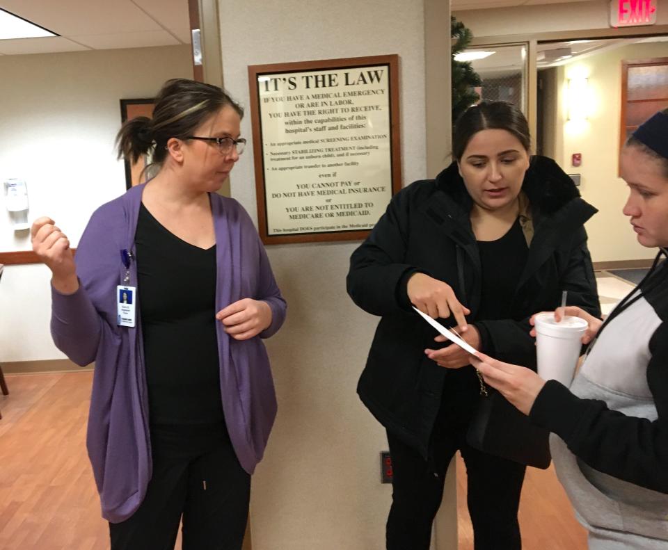 Obstetrician nurse Kara Hoftiezer, left, helps an expectant mother and English as a Second Language student at Prairies Lakes Hospital. Glacial Lakes Multicultural Center Administrative Assistant Yesika Muñoz, in the center, translated throughout the visit.