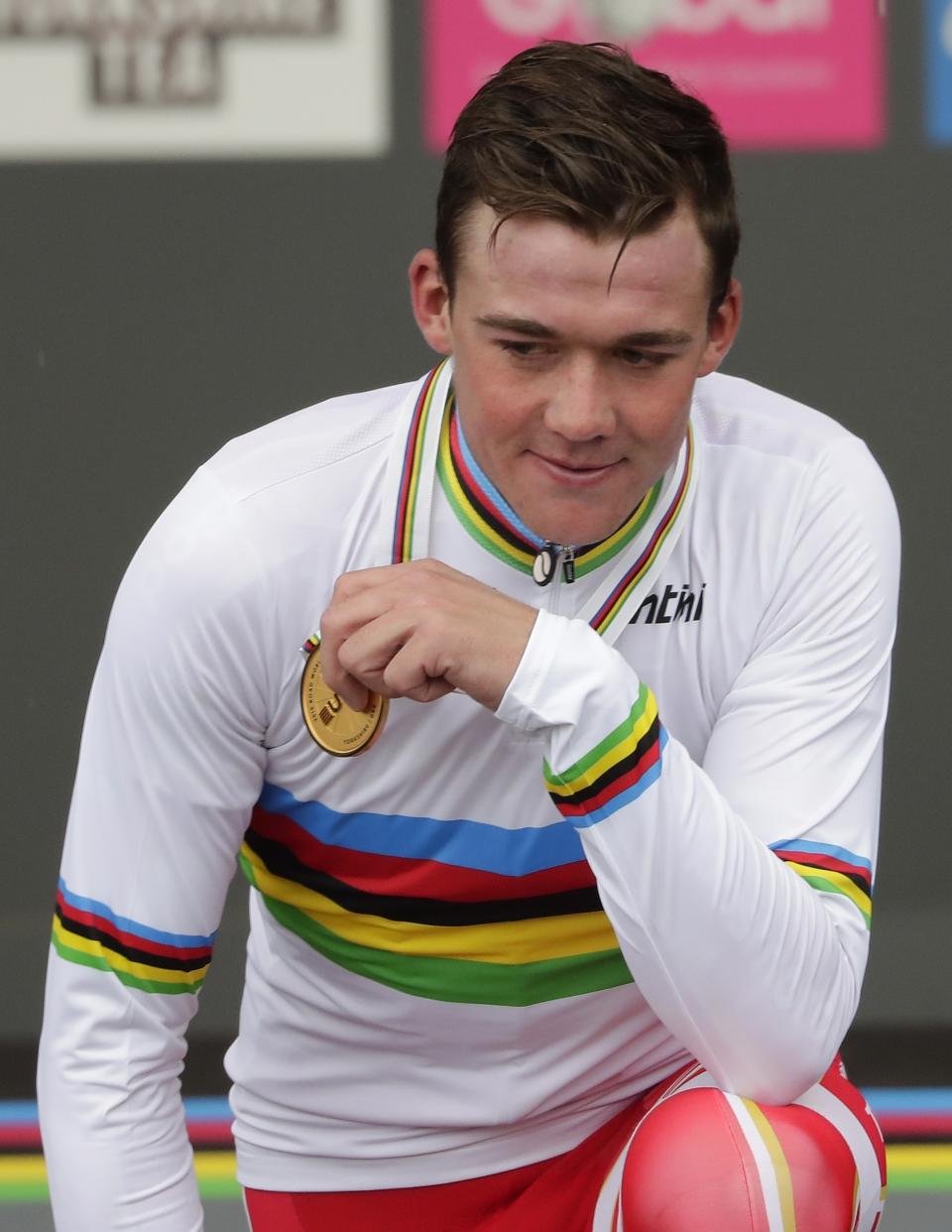 Denmark's Mads Pedersen poses with the gold medal of the men elite race, at the road cycling World Championships in Harrogate, England, Sunday, Sept. 29, 2019. (AP Photo/Manu Fernandez)