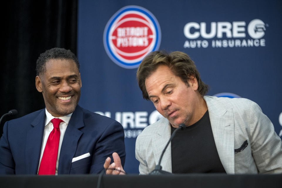 DETROIT, MICHIGAN – JULY 30: From left to right, Detroit Pistons general manager Troy Weaver smiles as he listens to owner Tom Gores during the press conference on July 30, 2021 at the Pistons Performance Center in Detroit, Michigan.  (Photo by Nic Antaya/Getty Images)