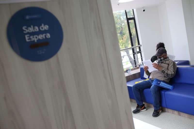 A man wearing a face mask sits in the waiting room of the Zerenia clinic, the first clinic specializing in medical marijuana treatments, in Bogota