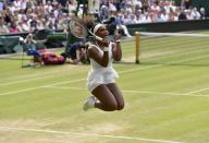 Serena Williams of the U.S.A. celebrates after winning her match against Victoria Azarenka of Belarus at the Wimbledon Tennis Championships in London, July 7, 2015. REUTERS/Toby Melville