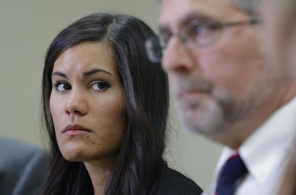 Weberg and Bryan Hershman, one of her attorneys. (Ted S. Warren/AP)