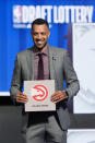Atlanta Hawks general manager Landry Fields poses for photos after NBA Deputy Commissioner Mark Tatum announced that the Hawks had won the first pick in the NBA draft, during the draft lottery in Chicago, Sunday, May 12, 2024. (AP Photo/Nam Y. Huh)