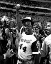 Hank Aaron holds a the ball he hit for his 715th career home run Monday night, April 8, 1974, in Atlanta Stadium against the Los Angeles Dodgers. (AP Photo/Bob Daugherty)