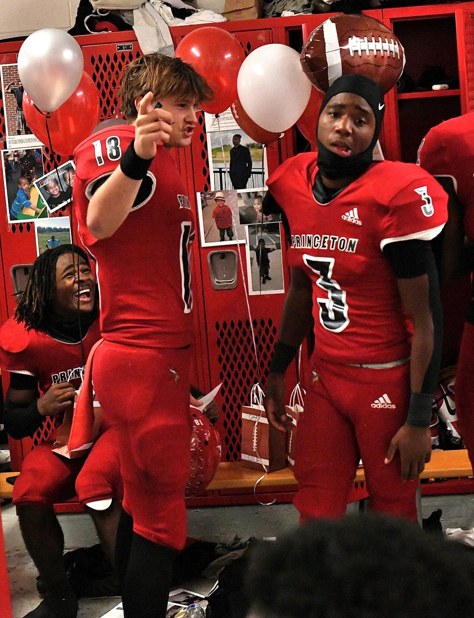 DeAngelo Birch and Antonio Hunter celebrate the Princeton Vikings' 10-0 season and Greater Miami Conference championship in the locker room after their 42-7 win over Sycamore, Oct. 20, 2023.