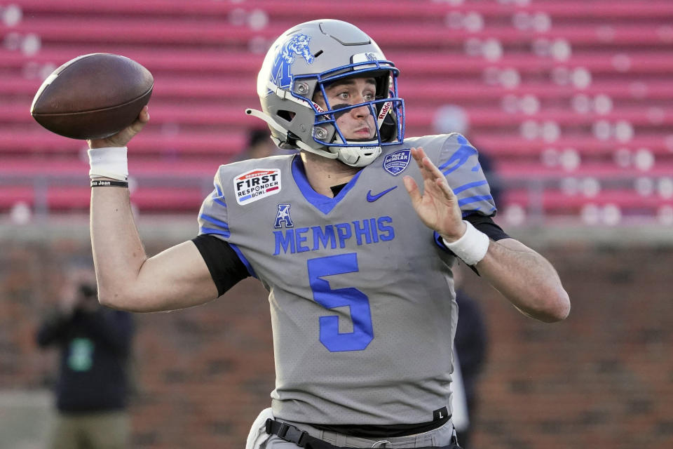 Memphis quarterback Seth Henigan (5) throws the ball during the second half of the First Responder Bowl NCAA college football game against Utah State, Tuesday, Dec. 27, 2022, in Dallas. (AP Photo/Sam Hodde)