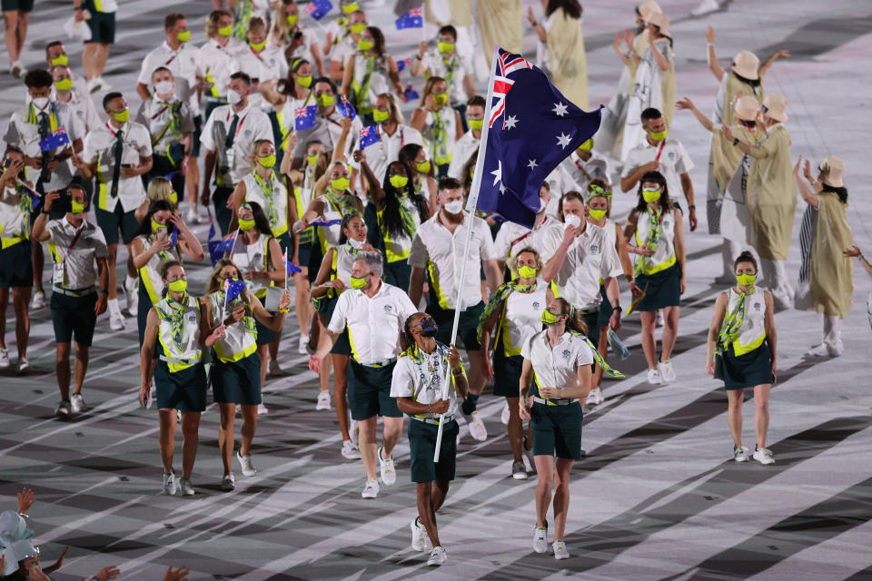 Australia flag bearers Cate Campbell and Patty Mills are seen here leading their team in for the opening ceremony. 