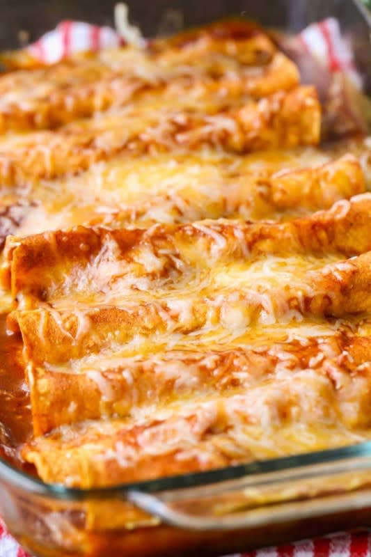 <p>These restaurant-style red cheese enchiladas are saucy, cheesy and oh-so-yummy!</p><p><strong>Get the recipe: <a href="https://lilluna.com/red-cheese-enchiladas-recipe/" rel="nofollow noopener" target="_blank" data-ylk="slk:Red Cheese Enchiladas;elm:context_link;itc:0;sec:content-canvas" class="link rapid-noclick-resp">Red Cheese Enchiladas</a></strong></p><p><strong>Related: <a href="https://parade.com/1330287/kristamarshall/mexican-rice/" rel="nofollow noopener" target="_blank" data-ylk="slk:How to Make Easy Mexican Rice;elm:context_link;itc:0;sec:content-canvas" class="link rapid-noclick-resp">How to Make Easy Mexican Rice</a></strong></p>