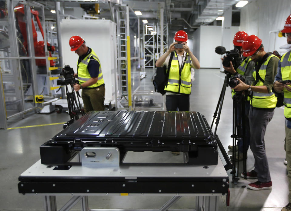 FILE - A Tesla battery pack is displayed during a media tour of the new Tesla Motors Inc., Gigafactory Tuesday, July 26, 2016, in Sparks, Nev. Interest in lithium has exploded in recent years because of its use in rechargeable batteries for electric and hybrid cars, lawnmowers, power tools and more. Lithium batteries also power laptops and cell phones. (AP Photo/Rich Pedroncelli, File)