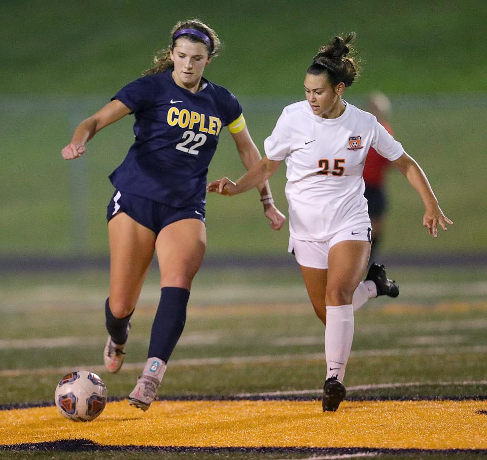 Copley's Ashley Kerekes dribbles the ball down field as Green's Gwendalyn Edwards defends on Monday, Sept. 12, 2022 in Copley.