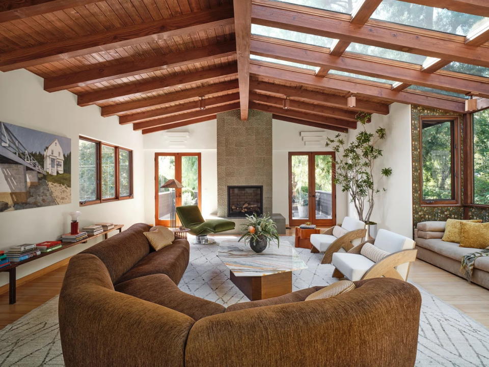 Spacious contemporary living room in Emma Chamberlain's renovated Los Angeles home.