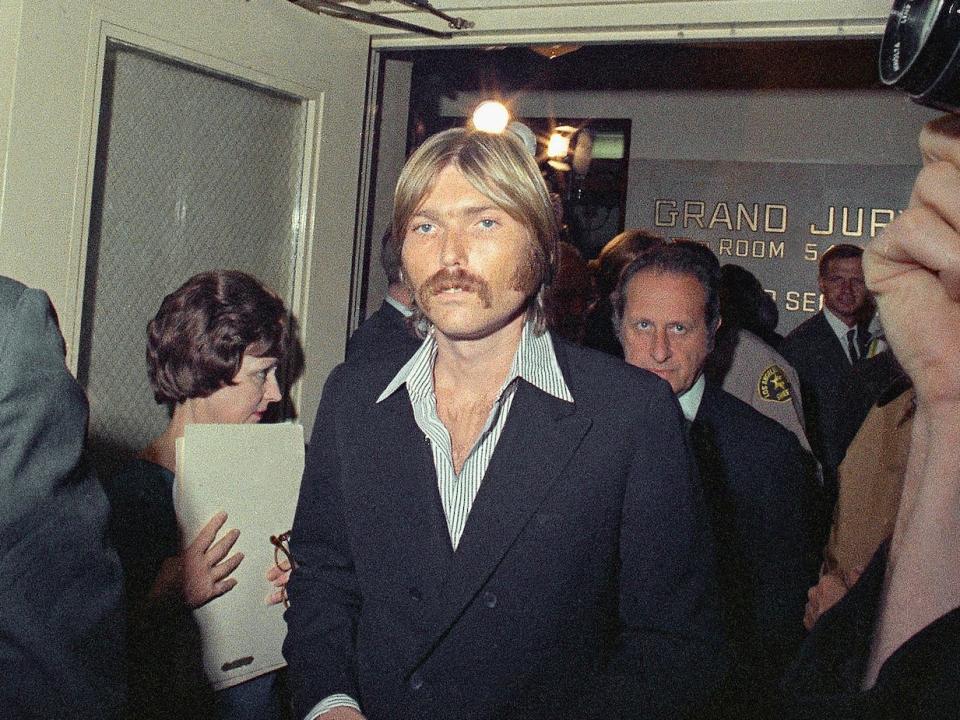 Terry Melcher, center, is shown leaving the grand jury room in Los Angeles after testifying in the Sharon Tate murder hearing