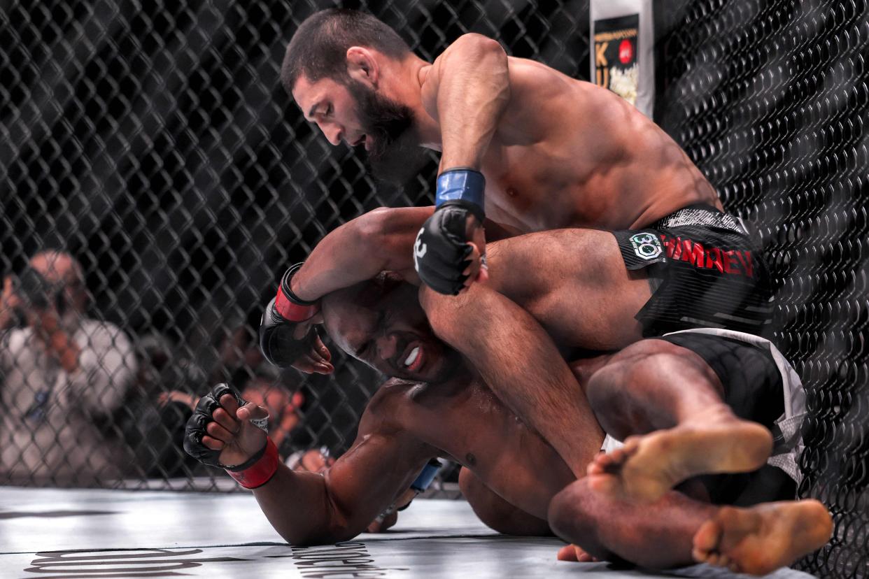 Khamzat Chimaev, right, en route to victory over Kamaru Usman (AFP via Getty Images)